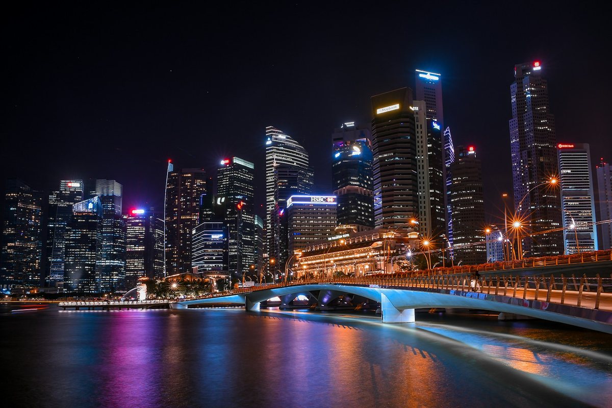 Singapore skyline at night across Marina Bay